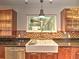 Modern kitchen with a farmhouse sink, stainless steel appliances, and mosaic backsplash at 1610 Se 22Nd Ave, Ocala, FL 34471