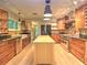 Spacious kitchen featuring custom cabinets, stainless steel appliances, and a center island at 1610 Se 22Nd Ave, Ocala, FL 34471