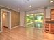 Living area with barn door, wood floors, sliding glass doors to covered porch at 1610 Se 22Nd Ave, Ocala, FL 34471