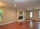 Living room showcasing fireplace, hardwood floors, and natural light at 1610 Se 22Nd Ave, Ocala, FL 34471