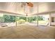 Covered outdoor patio with ceiling fans offering views of the expansive backyard at 1610 Se 22Nd Ave, Ocala, FL 34471