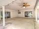 Covered outdoor patio with ceiling fans and access to the backyard at 1610 Se 22Nd Ave, Ocala, FL 34471
