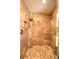 Luxurious tiled shower with a mosaic tile floor at 1610 Se 22Nd Ave, Ocala, FL 34471
