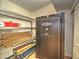 Secured room with metal shelves and new flooring for storage at 1610 Se 22Nd Ave, Ocala, FL 34471