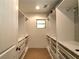 Walk-in closet with custom shelving and ample storage at 1610 Se 22Nd Ave, Ocala, FL 34471