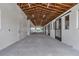 Spacious barn interior with high ceilings, ample lighting, and access to stalls at 1631 W Hwy 329, Citra, FL 32113