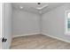 Bright bedroom featuring wood-look floors, white trim, and recessed lighting at 1631 W Hwy 329, Citra, FL 32113