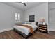 Cozy bedroom with natural light, stylish furnishings, and hardwood floors at 1631 W Hwy 329, Citra, FL 32113
