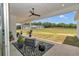 Covered patio with seating area overlooking a horse pasture at 1631 W Hwy 329, Citra, FL 32113