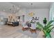 Open dining area featuring modern light fixtures and views into the kitchen at 1631 W Hwy 329, Citra, FL 32113