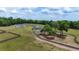 Expansive ranch estate featuring lush pastures, mature trees, and a secondary building for flexible living or storage at 1631 W Hwy 329, Citra, FL 32113