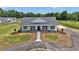 Lovely single-story home featuring a circular driveway and a cozy front porch at 1631 W Hwy 329, Citra, FL 32113