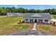 Beautifully maintained estate with a charming home, inviting front porch, and a separate guest house at 1631 W Hwy 329, Citra, FL 32113