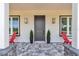 Charming front entrance highlighted by elegant lighting and inviting seating at 1631 W Hwy 329, Citra, FL 32113