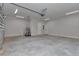Spacious two-car garage featuring concrete floors, ample lighting, and plenty of storage space at 1631 W Hwy 329, Citra, FL 32113
