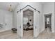 Home office featuring barn door, window with shutters, modern decor, and natural lighting at 1631 W Hwy 329, Citra, FL 32113