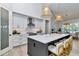 Bright kitchen with stainless steel appliances, an island with seating, and modern fixtures at 1631 W Hwy 329, Citra, FL 32113