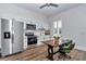 Bright kitchen with white cabinets, stainless steel appliances, and a view from a window at 1631 W Hwy 329, Citra, FL 32113