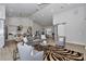 Spacious living room featuring vaulted ceiling, open floor plan, and modern decor at 1631 W Hwy 329, Citra, FL 32113