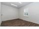 A bright room with wood floors, white walls, and a window with shutters at 1631 W Hwy 329, Citra, FL 32113