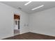 A bright room with wood floors, white walls, and a doorway at 1631 W Hwy 329, Citra, FL 32113
