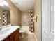 Bathroom features a vanity with white countertop and a shower and tub combo at 16405 Sw 14Th Avenue Rd, Ocala, FL 34473
