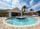 Community pool area featuring a shallow splash pool and lounge area under a shaded patio at 16405 Sw 14Th Avenue Rd, Ocala, FL 34473
