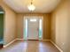 Bright and spacious foyer with tile flooring, neutral walls, and a clear view of the front door at 16405 Sw 14Th Avenue Rd, Ocala, FL 34473