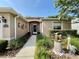 Close up shot of the front entrance featuring a decorative security door, garden and walkway at 16405 Sw 14Th Avenue Rd, Ocala, FL 34473