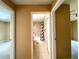 Hallway view of a bathroom with tub and bedrooms at 16405 Sw 14Th Avenue Rd, Ocala, FL 34473