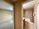 Hallway view of two bedrooms and a bathroom with shower and tub at 16405 Sw 14Th Avenue Rd, Ocala, FL 34473