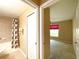 Hallway view of bedroom and bathroom with tub and shower at 16405 Sw 14Th Avenue Rd, Ocala, FL 34473