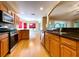 Kitchen showcases stainless steel appliances, wood cabinetry, and access to dining area at 16405 Sw 14Th Avenue Rd, Ocala, FL 34473