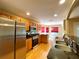 Modern kitchen design with stainless steel appliances, wooden cabinetry, and granite countertops for style and convenience at 16405 Sw 14Th Avenue Rd, Ocala, FL 34473
