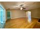 Spacious living room boasts gleaming hardwood floors, neutral walls, and a stylish ceiling fan at 16405 Sw 14Th Avenue Rd, Ocala, FL 34473