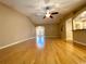 Spacious living room with hardwood floors, a ceiling fan, and an arched entry at 16405 Sw 14Th Avenue Rd, Ocala, FL 34473