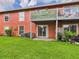 A view of the exterior facade, showcasing a balcony and patio at 1801 Caralee Blvd # 2, Orlando, FL 32822