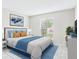 Calm bedroom featuring a comfortable bed, bright window, and decor for a restful retreat at 1801 Caralee Blvd # 2, Orlando, FL 32822