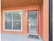 Inviting front entrance with bright red door open, revealing a clean hallway at 1801 Caralee Blvd # 2, Orlando, FL 32822