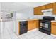 Functional kitchen featuring standard appliances, ample counter space, and an efficient layout at 1801 Caralee Blvd # 2, Orlando, FL 32822