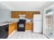 Functional kitchen featuring standard appliances, ample counter space, and natural light at 1801 Caralee Blvd # 2, Orlando, FL 32822