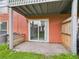 Enclosed patio with sliding glass door leads to outdoor living space at 1801 Caralee Blvd # 2, Orlando, FL 32822