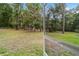 View from screen porch: sprawling backyard with lush greenery and mature trees at 19028 Sw 101 Pl, Dunnellon, FL 34432