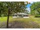 The spacious yard offers plenty of room for relaxing and outdoor activities at 19028 Sw 101 Pl, Dunnellon, FL 34432