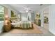 Serene bedroom with rustic furniture, soft colors, and natural light, creating a relaxing retreat at 19028 Sw 101 Pl, Dunnellon, FL 34432