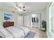 Cozy bedroom with natural light, ceiling fan, and neutral tones for relaxation at 19028 Sw 101 Pl, Dunnellon, FL 34432