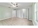 Bright bedroom featuring plush carpeting, a ceiling fan, and an open closet for optimal storage at 19028 Sw 101 Pl, Dunnellon, FL 34432
