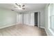 Bedroom features neutral carpeting, closet and access to other rooms at 19028 Sw 101 Pl, Dunnellon, FL 34432