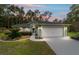 Charming home featuring landscaped front yard and two-car garage, perfect for suburban living at 19028 Sw 101 Pl, Dunnellon, FL 34432