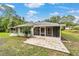 The screened-in porch and patio offers peaceful outdoor living at 19028 Sw 101 Pl, Dunnellon, FL 34432